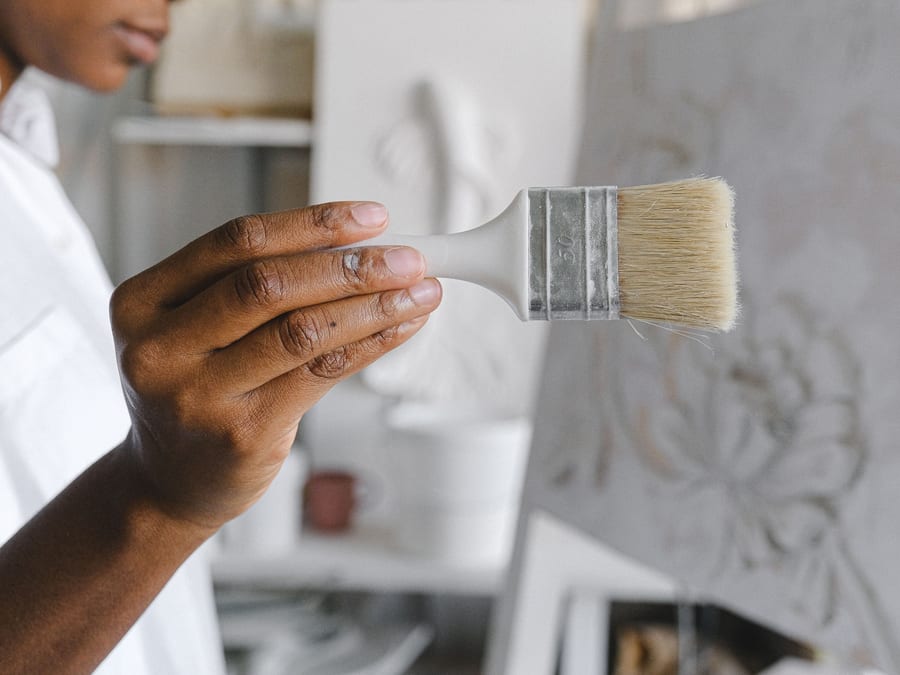 A brush held steady along a trim edge, the line kept true.