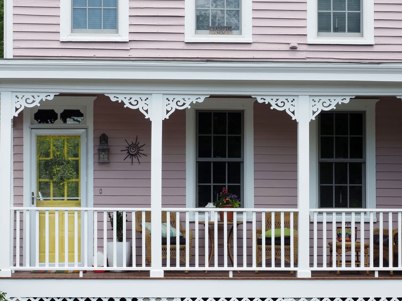 The detailed exterior of a restored historic building, its trim and mouldings carefully repainted.